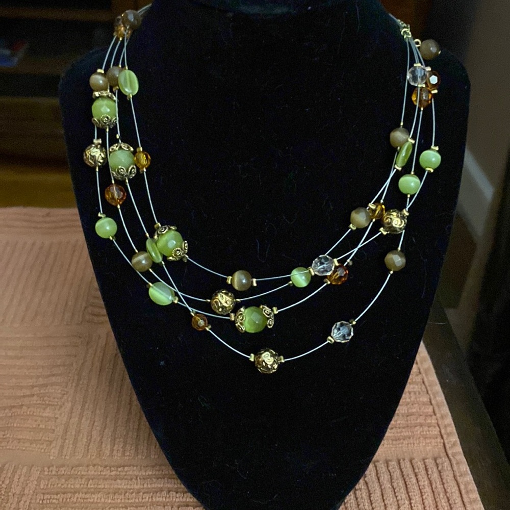Lia Sophia multi wire strand necklace with green & amber stones-gold plated